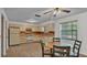 Bright kitchen with matching appliances, light wood cabinets, laminate countertops, and tile floors at 819 Swann Dr, Lakeland, FL 33809