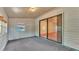 Enclosed lanai with neutral tones and sliding glass door to the main living room at 819 Swann Dr, Lakeland, FL 33809