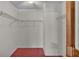 Walk-in closet with adjustable wire shelving and red carpeting at 819 Swann Dr, Lakeland, FL 33809