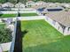 Aerial view of fenced backyard with white vinyl fencing and lush lawn at 860 Killarney Ln, Auburndale, FL 33823