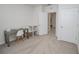 Neutral room featuring a desk, and open doorway leading to other rooms, and plenty of natural light at 860 Killarney Ln, Auburndale, FL 33823