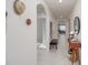 Bright hallway featuring stylish decor, arched doorways, and tile flooring at 860 Killarney Ln, Auburndale, FL 33823