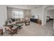 Cozy living room featuring plush seating, neutral tones, and ample natural light at 860 Killarney Ln, Auburndale, FL 33823