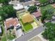 Charming neighborhood aerial view featuring a home with a fenced yard, pool, and well-kept lawn at 901 Spicewood Dr, Lakeland, FL 33801