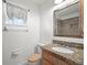 The bathroom features a wood vanity with granite countertop at 901 Spicewood Dr, Lakeland, FL 33801