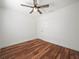 Bedroom features hardwood floors, a modern ceiling fan, and closet at 901 Spicewood Dr, Lakeland, FL 33801