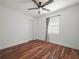 Bedroom features hardwood floors, a modern ceiling fan, and ample closet space at 901 Spicewood Dr, Lakeland, FL 33801