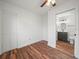 Bedroom features hardwood floors and en-suite bathroom at 901 Spicewood Dr, Lakeland, FL 33801