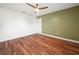 Cozy bedroom with wood-look tile floors and a neutral wall color at 901 Spicewood Dr, Lakeland, FL 33801