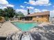 Inviting backyard pool area featuring lounge chairs and ample patio space for relaxation at 901 Spicewood Dr, Lakeland, FL 33801