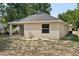 Rear exterior of the home with patio area and window at 950 W 2Nd St, Lakeland, FL 33805