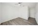 Bedroom with wood-look floors and a large window at 950 W 2Nd St, Lakeland, FL 33805