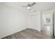 An open bedroom with wood-look floors and closet access at 950 W 2Nd St, Lakeland, FL 33805