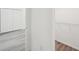 Shot of closet with wood-look floors and a rod to hang clothes at 950 W 2Nd St, Lakeland, FL 33805