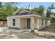 Charming bungalow with stone accents, new concrete driveway, and neutral paint at 950 W 2Nd St, Lakeland, FL 33805