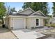 Charming single-story home featuring a one-car garage, neutral stucco, stone accents, and a cozy front porch at 950 W 2Nd St, Lakeland, FL 33805