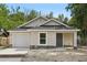 Charming single-story home with a garage, front porch, and well-maintained yard at 950 W 2Nd St, Lakeland, FL 33805