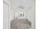 Open-concept space flows to kitchen area with recessed lighting and wood-look flooring at 950 W 2Nd St, Lakeland, FL 33805