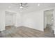 Bright living room featuring neutral walls, wood-look laminate flooring, and recessed lighting at 950 W 2Nd St, Lakeland, FL 33805