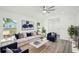 Bright living room with modern decor, ceiling fan, and hardwood floors at 950 W 2Nd St, Lakeland, FL 33805