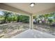 Covered patio overlooking a spacious, tree-lined backyard at 950 W 2Nd St, Lakeland, FL 33805