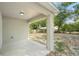 Covered patio overlooking a spacious, tree-lined backyard at 950 W 2Nd St, Lakeland, FL 33805