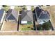 Expansive aerial view showcasing neighboring homes and fenced yards in a vibrant community at 983 Revere Ave, Haines City, FL 33844
