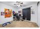 A bedroom with personal decor, neutral walls, carpet, and a ceiling fan at 983 Revere Ave, Haines City, FL 33844