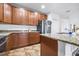 Stylish kitchen features granite countertops, stainless steel appliances, and ample cabinet space at 983 Revere Ave, Haines City, FL 33844