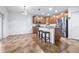Bright kitchen with stainless steel appliances, granite countertops, and an island with seating at 983 Revere Ave, Haines City, FL 33844