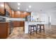 Modern kitchen with stainless steel appliances, granite countertops, and an island perfect for entertaining at 983 Revere Ave, Haines City, FL 33844