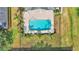 Overhead shot of a backyard featuring a swimming pool and palm trees at 1036 Stoney Creek Dr, Lakeland, FL 33811