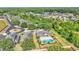 Aerial view of homes with backyard pools and lush landscaping in a tranquil neighborhood at 1036 Stoney Creek Dr, Lakeland, FL 33811