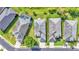 Aerial view of homes with well-maintained lawns and one with a screened pool in a desirable neighborhood at 1036 Stoney Creek Dr, Lakeland, FL 33811