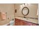 Well-appointed bathroom with granite countertops, single sink, ample lighting, and modern toilet at 1036 Stoney Creek Dr, Lakeland, FL 33811