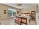 Comfortable bedroom with a ceiling fan, a window, and a wooden accent chest at the foot of the bed at 1036 Stoney Creek Dr, Lakeland, FL 33811
