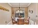Charming dining room with wood table and chairs, perfect for intimate gatherings or Gathering meals at 1036 Stoney Creek Dr, Lakeland, FL 33811