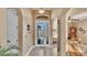 Welcoming foyer featuring double front doors, arched entries, and tiled floor at 1036 Stoney Creek Dr, Lakeland, FL 33811