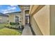 Elegant front entrance with stone details, double doors, and tasteful landscaping at 1036 Stoney Creek Dr, Lakeland, FL 33811