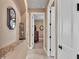 Inviting hallway with decor and neutral tones leads to various rooms, enhancing flow and appeal at 1036 Stoney Creek Dr, Lakeland, FL 33811