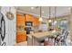 Well-equipped kitchen features a breakfast bar, pendant lighting, and modern appliances for culinary enthusiasts at 1036 Stoney Creek Dr, Lakeland, FL 33811