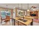 Open-concept kitchen and dining area boasts a breakfast bar, modern appliances, and ample space for entertaining at 1036 Stoney Creek Dr, Lakeland, FL 33811