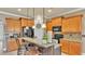 Beautiful kitchen showcasing a breakfast bar, wooden cabinets, and modern appliances for seamless cooking at 1036 Stoney Creek Dr, Lakeland, FL 33811