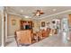 Inviting living room with leather seating, a ceiling fan, and a view of the front door at 1036 Stoney Creek Dr, Lakeland, FL 33811