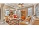 Bright living room with an open layout that showcases a cozy sitting area adjacent to the dining area at 1036 Stoney Creek Dr, Lakeland, FL 33811