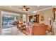 Cozy living room with sliding glass door leading to lanai, media center, and comfortable seating at 1036 Stoney Creek Dr, Lakeland, FL 33811