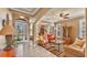 Bright and airy living room with arched doorways, ceiling fan, and comfortable seating at 1036 Stoney Creek Dr, Lakeland, FL 33811
