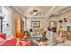 Comfortable living room featuring traditional decor, arched doorways, and neutral tones at 1036 Stoney Creek Dr, Lakeland, FL 33811