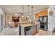 Spacious living area connects to kitchen and dining area with a breakfast bar for an open concept feel at 1036 Stoney Creek Dr, Lakeland, FL 33811