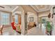 Open-concept living spaces with tile flooring, arched doorways, and neutral color palette at 1036 Stoney Creek Dr, Lakeland, FL 33811